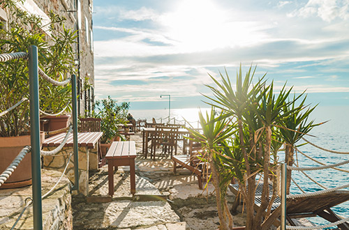 restaurant-tables-at-sea-beach-rovinj-istria-croatia-shutterstock1932415853