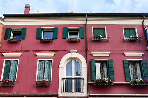 typical-colorful-houses-caorle-veneto-italy-shutterstock2223827359