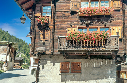 wooden-houses-in-grimentz-val-danniviers-valais-switzerland-shutterstock2133819517