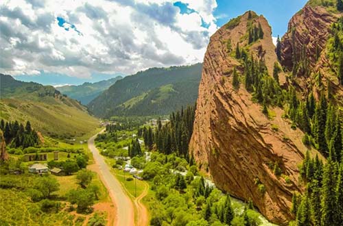 kyrgyzstan-road-surrounded-by-mountains