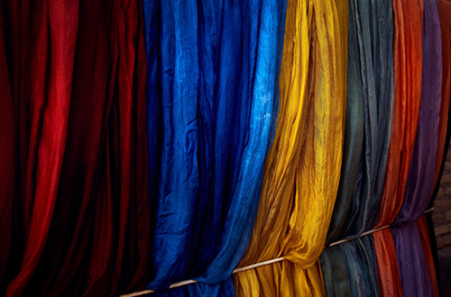 traditional-silk-scarves-at-local-craft-bazaar-khiva-uzbekistan-shutterstock2591121097