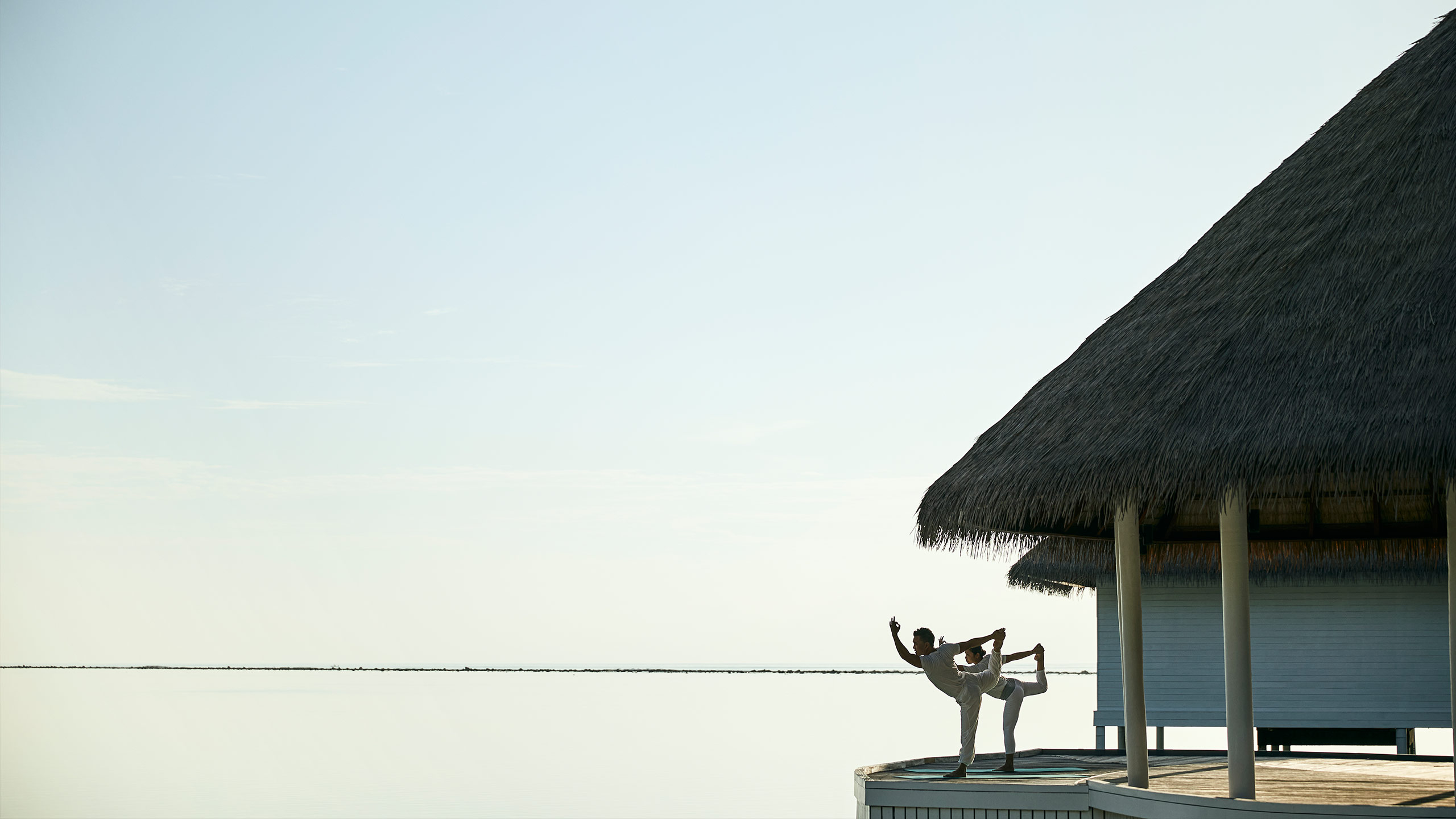 como-maalifushi-thaa-atoll-maldives-pavilion-yoga-session