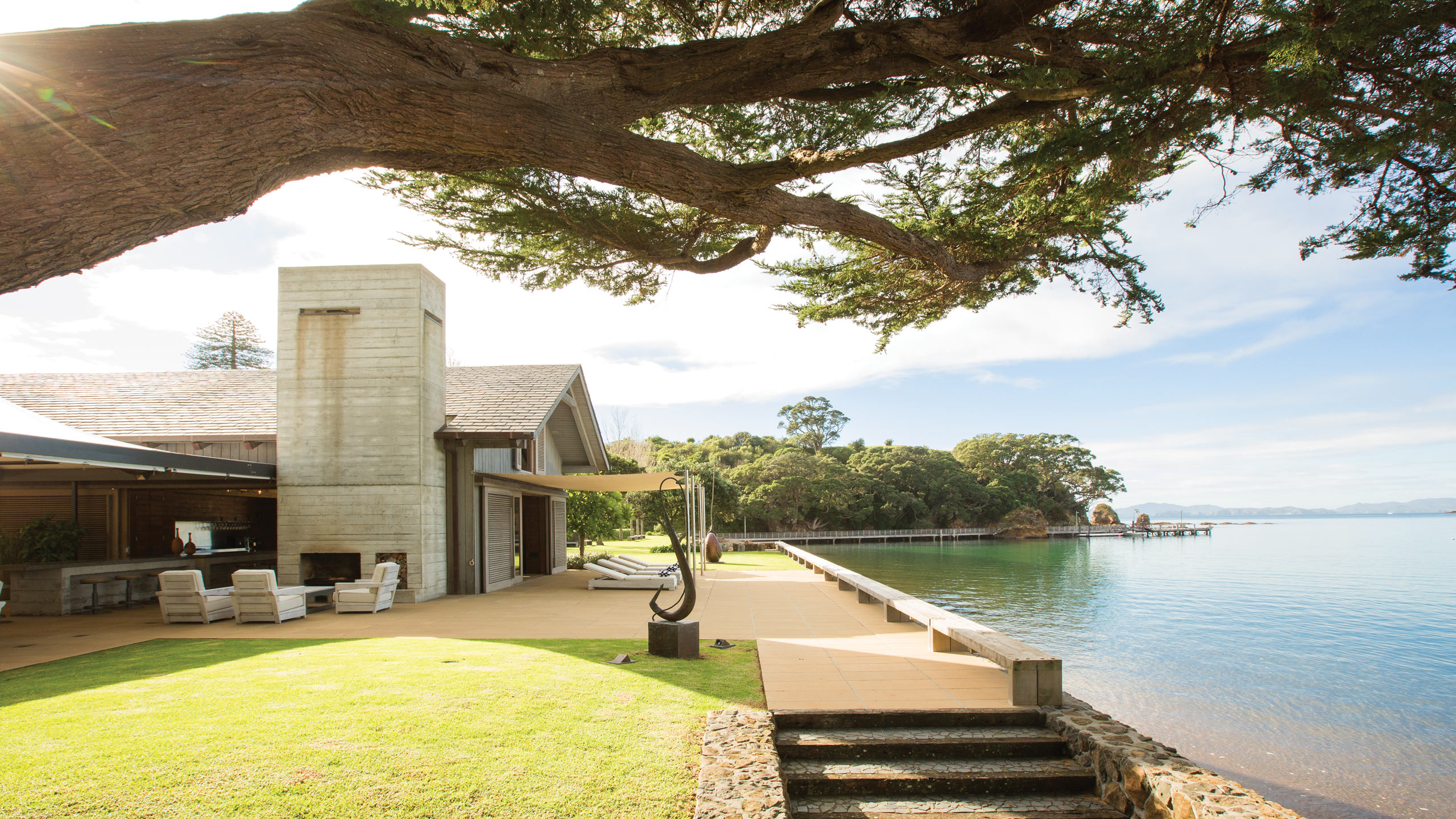 the-landing-bay-of-islands-new-zealand-the-boathouse-view-artwork-on-beach