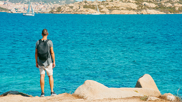 sardinia-italy-hiker-shutterstock_1995058952