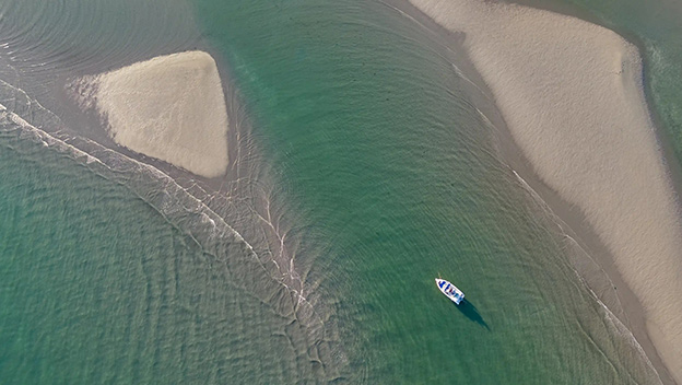 sandy-beach-in-costal-town-grado-friuli-venezia-giulia-italy-shutterstock2534710507