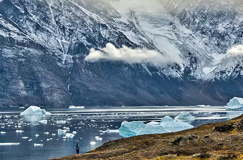 greenlandic-fjord-against-a-towering-mountain-backdrop