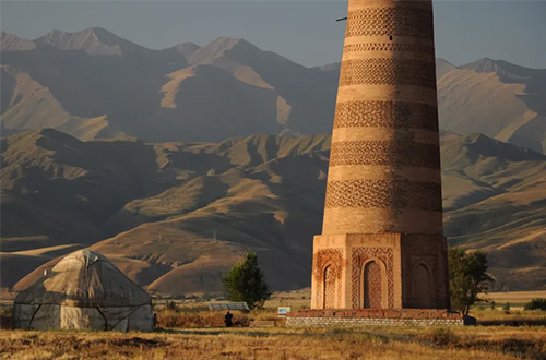 burana-tower-kyrgysten-yurt-and-mountains-background.