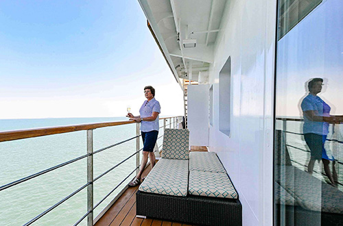 coral-adventurer-person-on-bridge-deck-balcony-suite