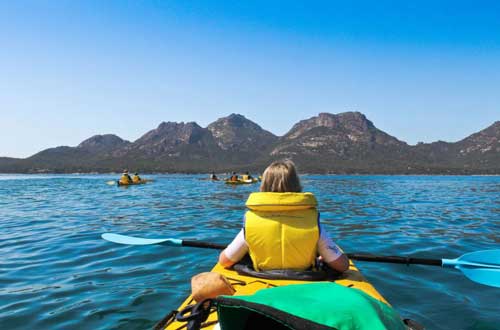 Tasmania-luxury-adventure-australia-freycinet-national-park-kayaker-