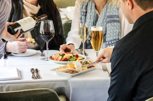 JBRE-on-train-platinum-club-close-up-of-drinks-and-cheese-platter